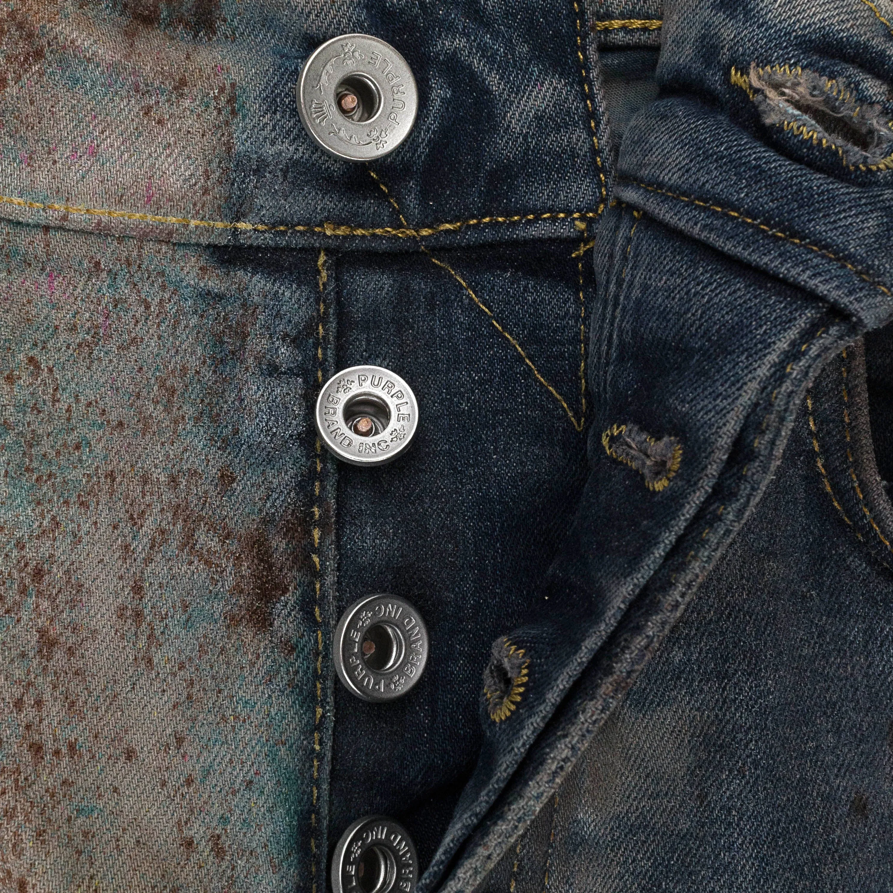 MULTICOLOR-SPRÜH-EFFEKT ÜBER GEBLEICHTE INDIGO SKINNY JEANS